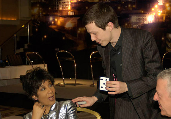 man showing card to woman